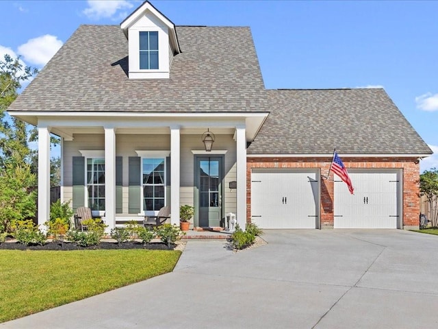 view of front of property featuring a garage and a front lawn