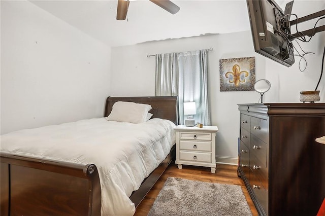 bedroom with lofted ceiling, ceiling fan, and wood-type flooring