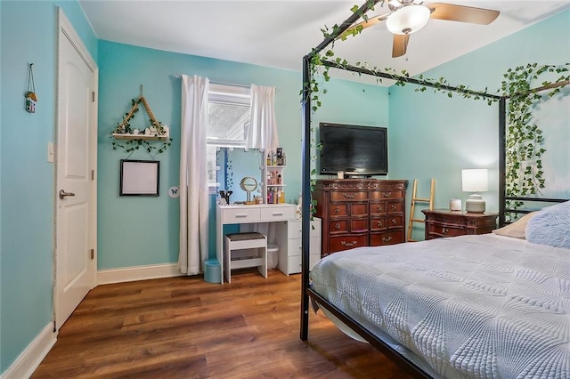 bedroom featuring ceiling fan and dark hardwood / wood-style floors