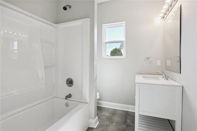 full bathroom featuring vanity, toilet,  shower combination, and tile patterned floors