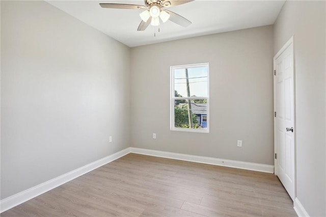 unfurnished room featuring light wood-type flooring and ceiling fan