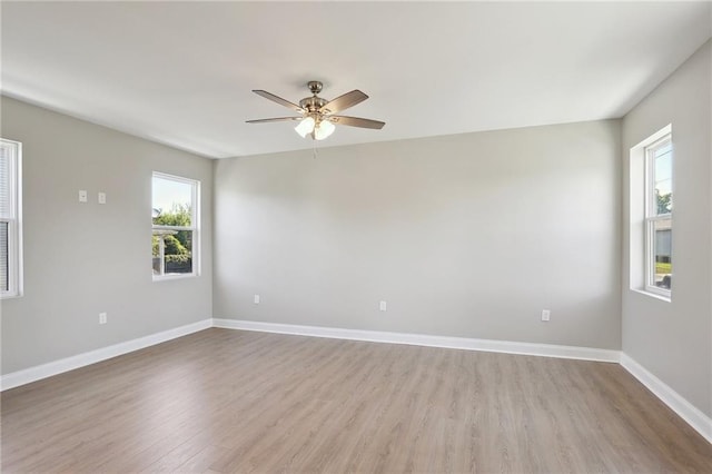 spare room with ceiling fan and wood-type flooring