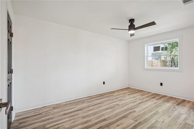 spare room with ceiling fan and light hardwood / wood-style flooring