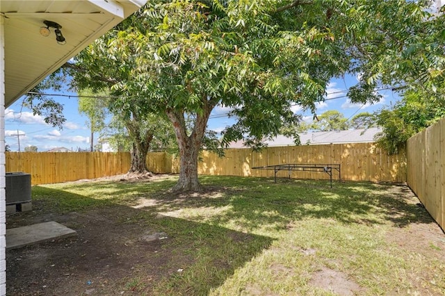 view of yard with central AC unit