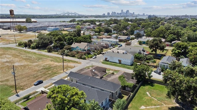 birds eye view of property with a city view, a water view, and a residential view