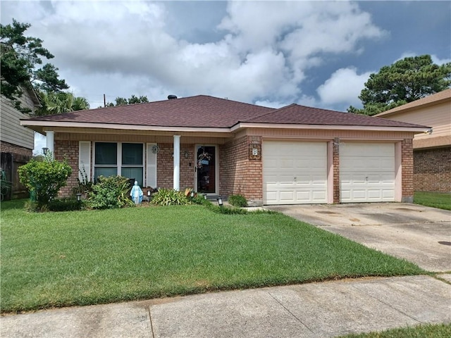 ranch-style home with a garage and a front yard