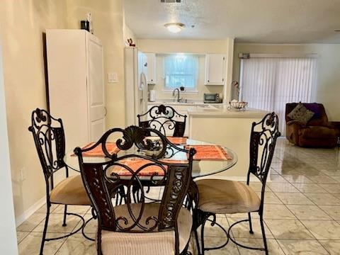 dining room with light tile patterned floors