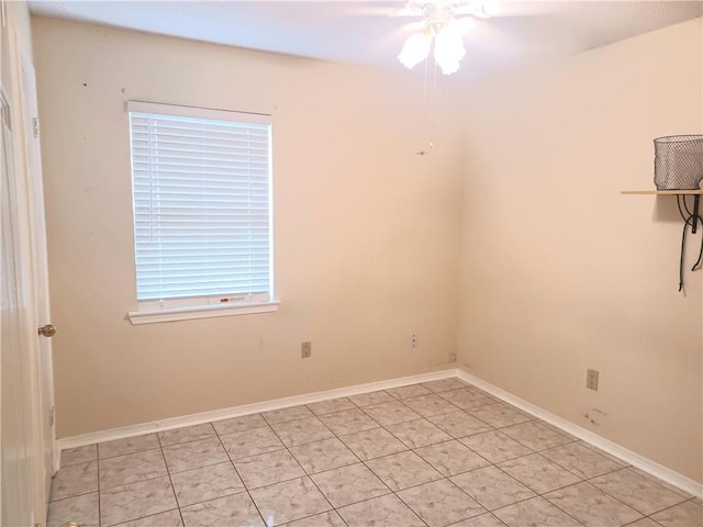 unfurnished room featuring ceiling fan and light tile patterned floors