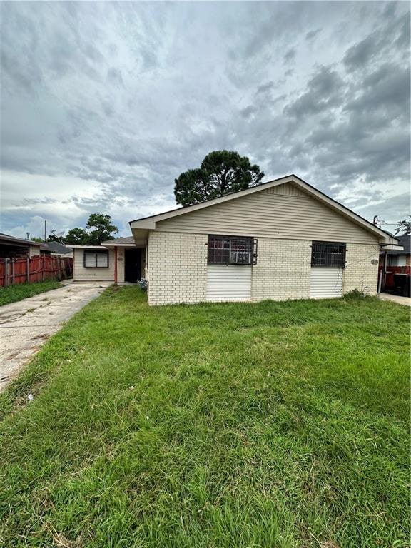 view of home's exterior featuring a yard