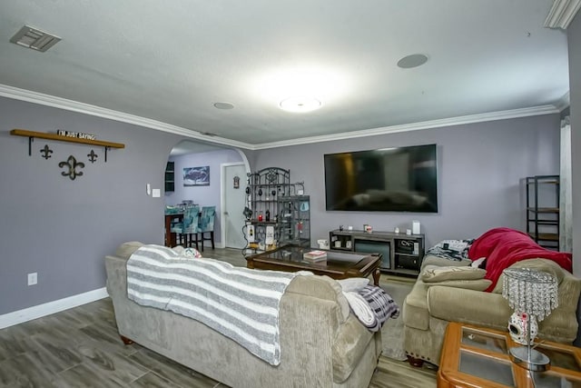 living room featuring ornamental molding and wood-type flooring