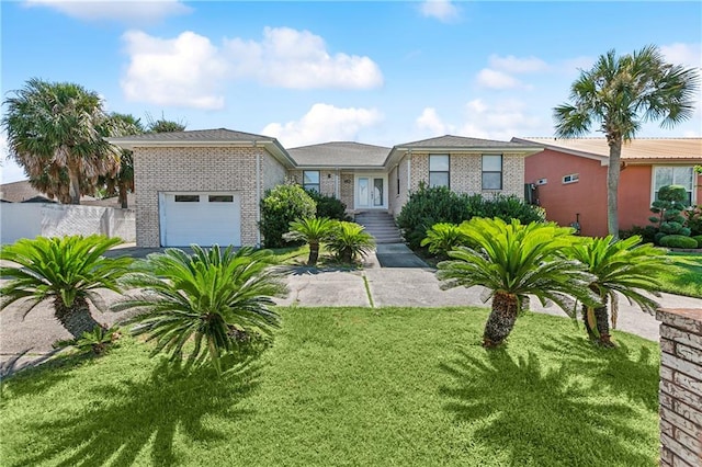 view of front of house featuring a garage and a front yard