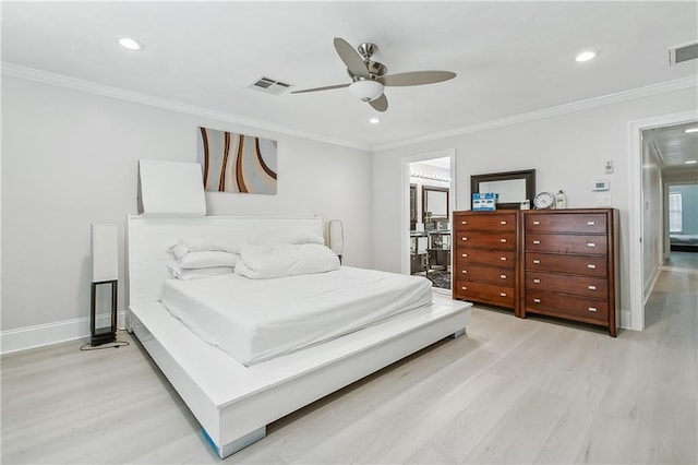 bedroom featuring ceiling fan, light hardwood / wood-style floors, and crown molding