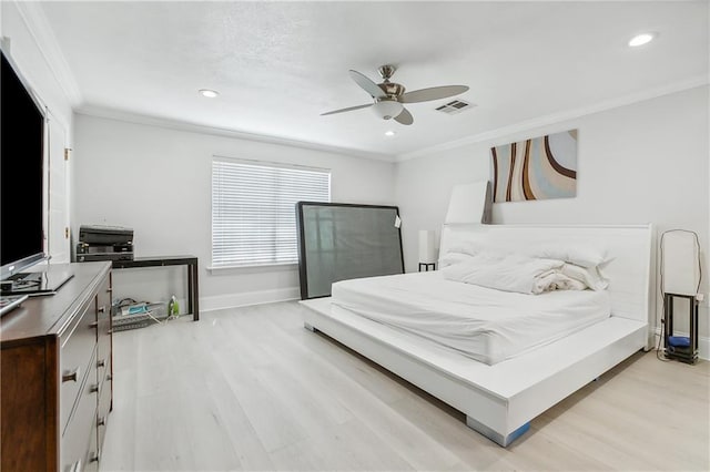 bedroom featuring crown molding, ceiling fan, and light hardwood / wood-style floors