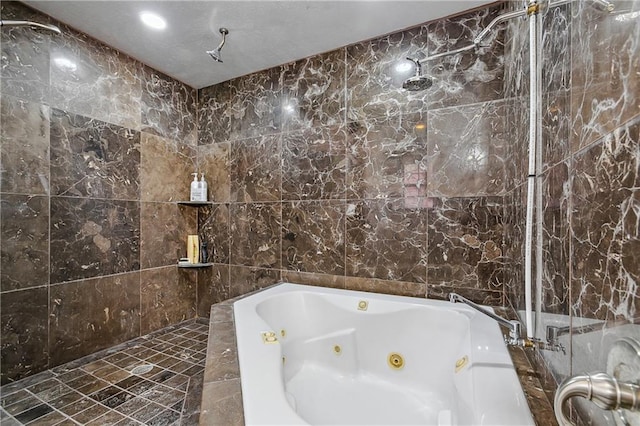 bathroom with tile walls and independent shower and bath