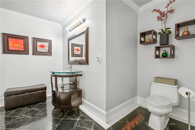 bathroom featuring vanity, toilet, crown molding, and tile patterned floors