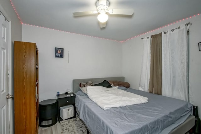 bedroom with ceiling fan and light wood-type flooring