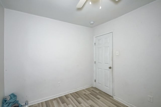 empty room with light wood-type flooring and ceiling fan