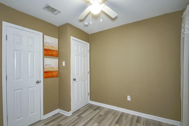 interior space with ceiling fan and light hardwood / wood-style floors