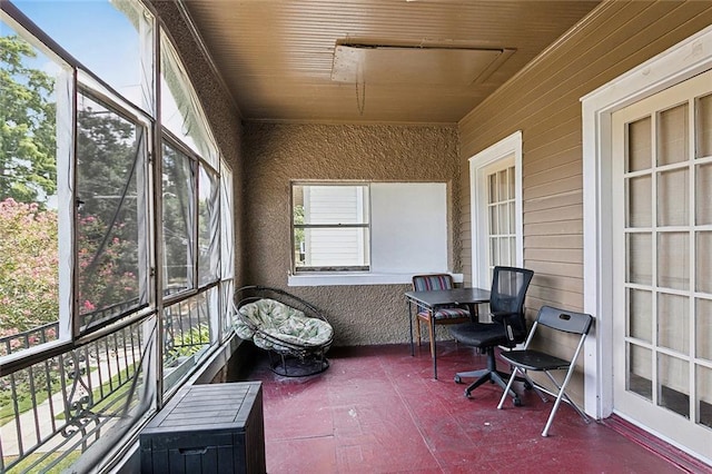 sunroom / solarium featuring wood ceiling