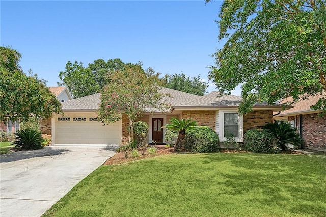 ranch-style house with a garage and a front lawn