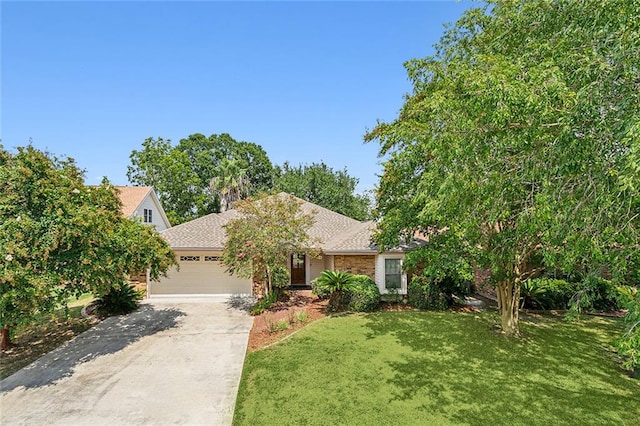 view of front of house with a front lawn and a garage