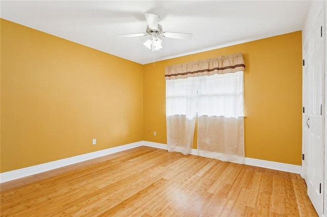 unfurnished room featuring hardwood / wood-style flooring and ceiling fan