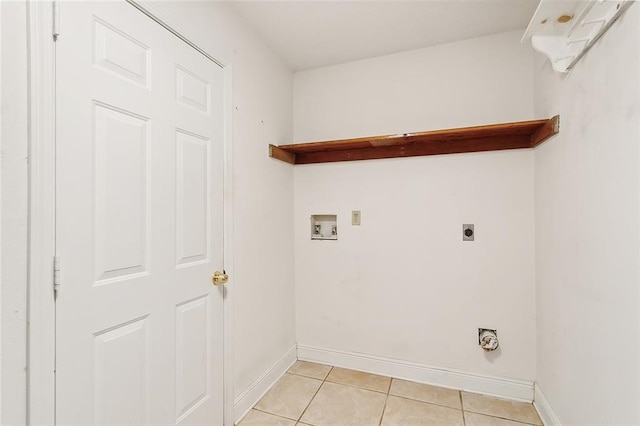 laundry room featuring hookup for a washing machine, light tile patterned flooring, and electric dryer hookup