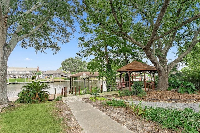 surrounding community featuring a water view, a gazebo, and a dock