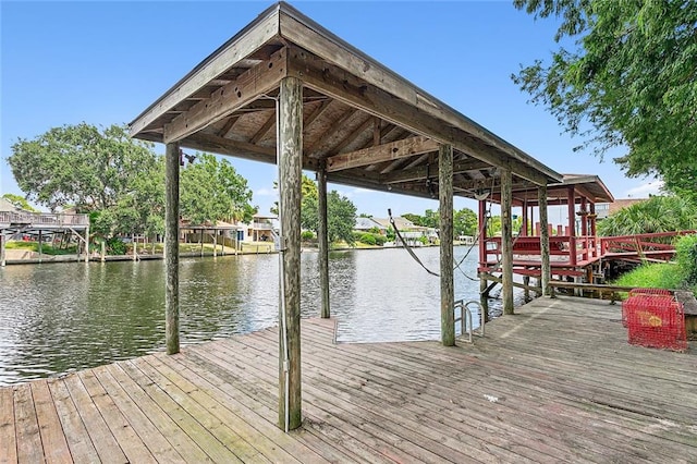 dock area with a water view