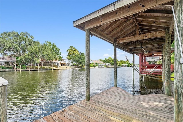 dock area with a water view