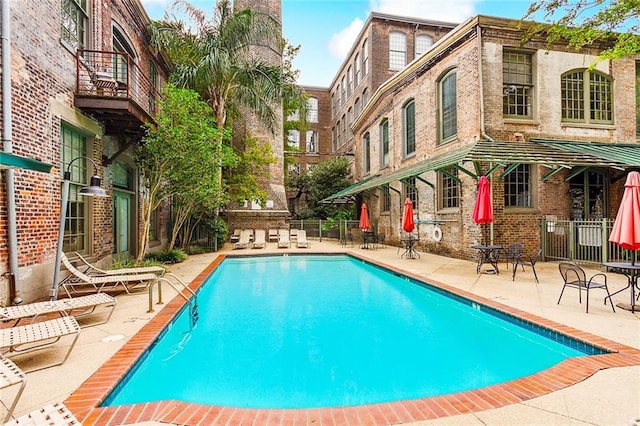 view of swimming pool featuring a patio area