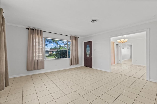 empty room featuring ornamental molding, a chandelier, and light tile patterned flooring