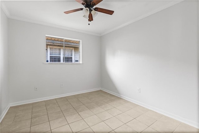 spare room featuring ceiling fan, ornamental molding, and light tile patterned floors