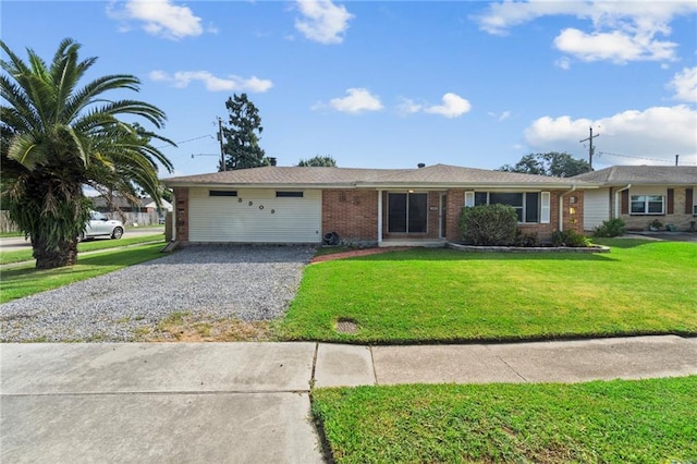 ranch-style house with a front yard and a garage