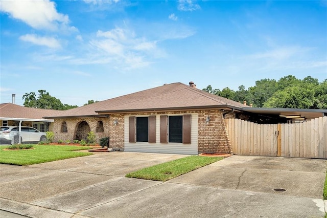 single story home featuring a carport