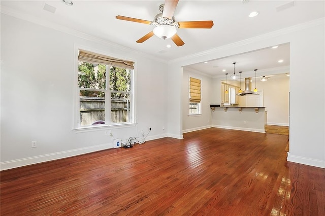 unfurnished living room with crown molding, ceiling fan, and dark hardwood / wood-style flooring