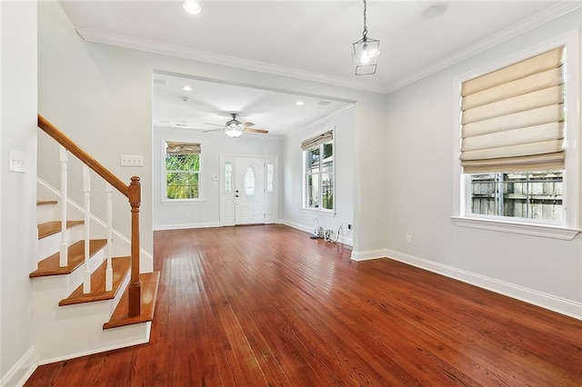 unfurnished living room with ceiling fan, hardwood / wood-style flooring, and ornamental molding