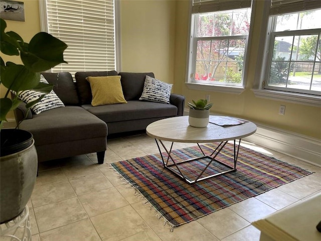 living room featuring a wealth of natural light and light tile patterned floors