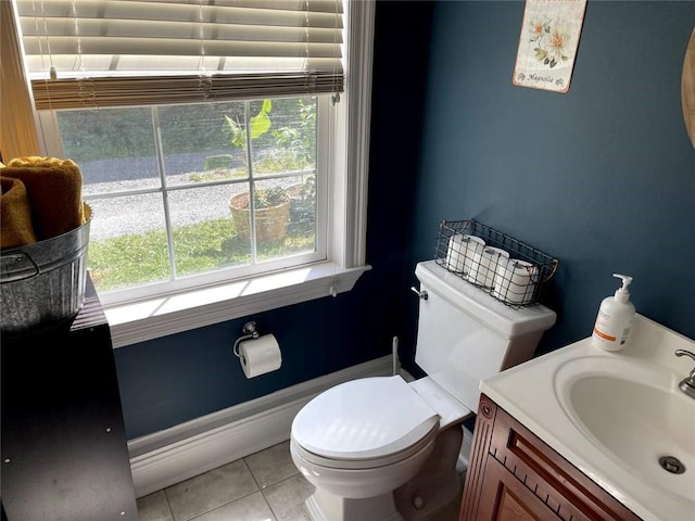 bathroom featuring vanity, toilet, and tile patterned floors