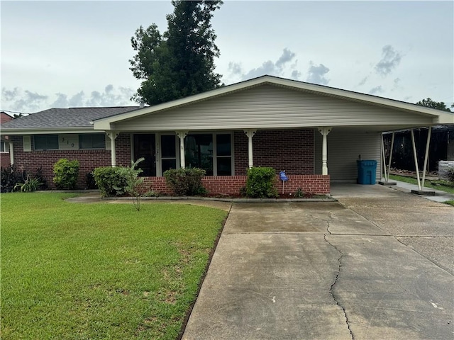 ranch-style home featuring a carport and a front yard