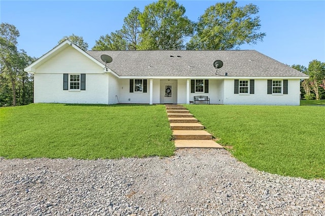 ranch-style house featuring a front lawn