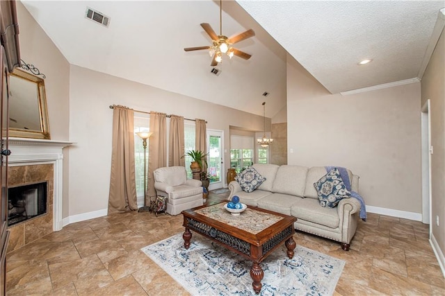 living room featuring a textured ceiling, ceiling fan with notable chandelier, a fireplace, and high vaulted ceiling