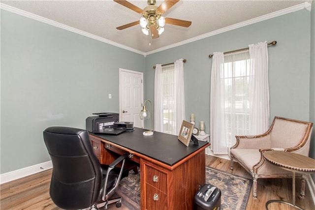 office space featuring ceiling fan, hardwood / wood-style floors, and a healthy amount of sunlight