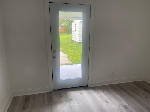 doorway to outside featuring light wood-type flooring