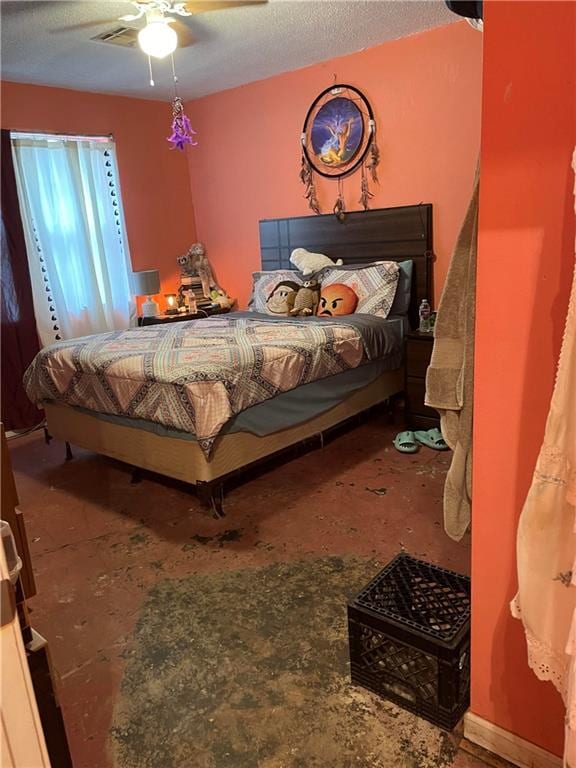 bedroom featuring a textured ceiling and ceiling fan