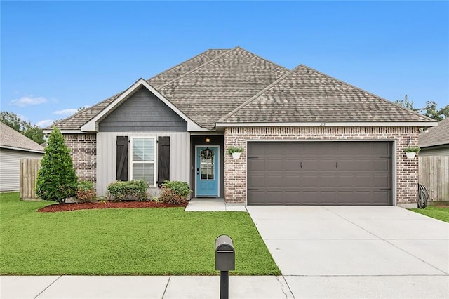 view of front facade with a garage and a front lawn