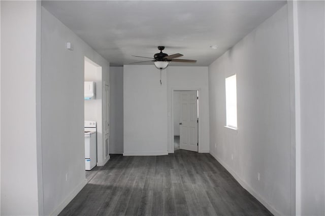 empty room with ceiling fan and dark hardwood / wood-style floors