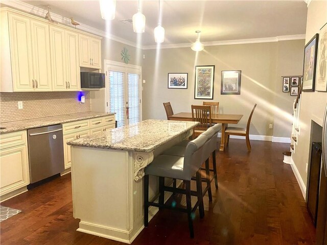 kitchen with crown molding, tasteful backsplash, decorative light fixtures, dishwasher, and dark hardwood / wood-style floors