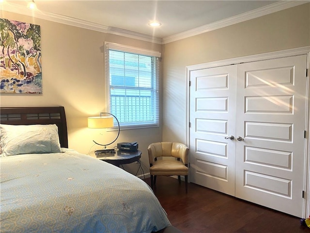 bedroom with a closet, ornamental molding, and dark wood-type flooring