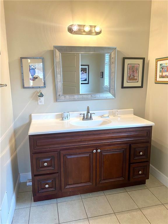 bathroom featuring vanity and tile patterned flooring